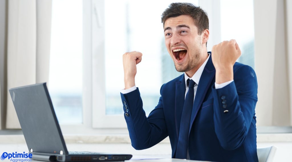 Broker working on laptop after closing deal